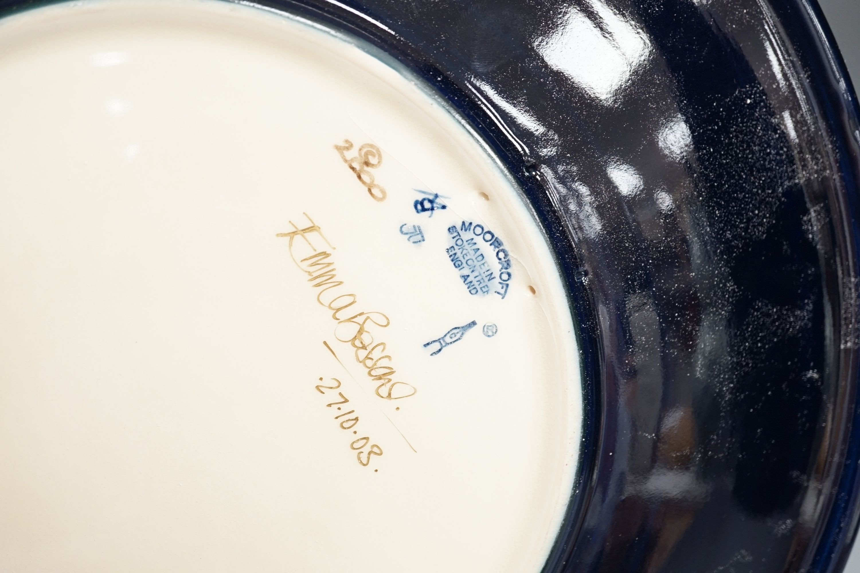 A Moorcroft Queen’s Choice pattern wall charger, dated 2003, signed by Emma Bossons, 36cm., in original box